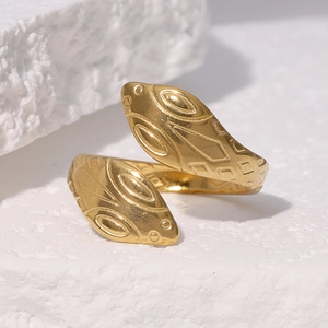 Minimalist snake-shaped open ring in 18k gold-plated stainless steel on a stone base