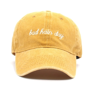 Classic mustard yellow baseball cap with bad hair day embroidery and soft washed cotton