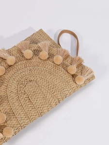 Chic woven straw clutch bag with tassel details and leather handle for summer outings