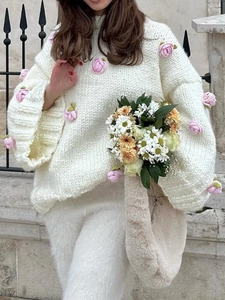 Elegant white chunky knit cardigan with pink 3D floral roses for women in autumn