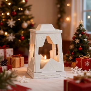 Close-up of a white star cutout Christmas lantern candle holder with Merry Christmas relief