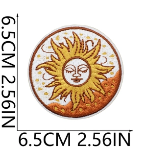Close-up of sun face embroidered patch showing 6.5cm diameter scale and golden stitching
