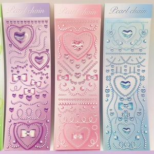 Three-pack of Y2K heart and pearl chain stickers in purple pink and blue finishes