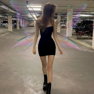 Close-up of black bodycon mini dress with thin straps and fairycore wing effect