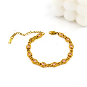 Detail of 18K gold-plated chain bracelet with inlaid pink zircon and lobster clasp