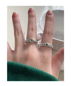 Detail of S925 sterling silver rings with green star gem and colorful zircon stones