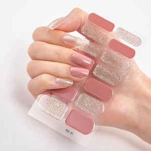 Detail view of model showing pink and rose gold glitter 3D nail polish wrap stickers