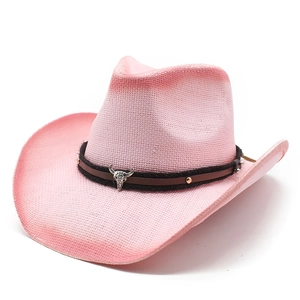 Pink woven straw cowboy hat featuring a silver bull head pendant on a black studded band