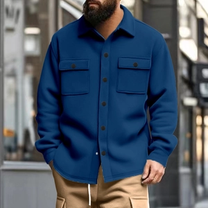 Detail shot of navy blue waffle knit jacket with dual flap pockets and button-up front