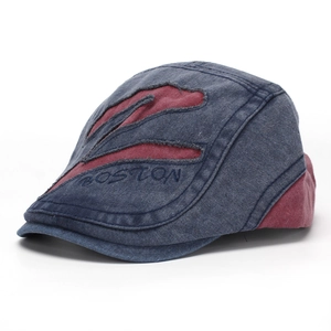 Detailed view of washed distressed flat cap with Boston embroidery and patchwork design