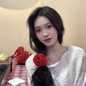 Elegant red rose floral scrunchie hair tie on woman for autumn and winter 2024