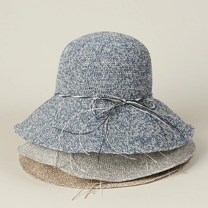 Stacked handmade crochet sun hats showing texture and multiple color options