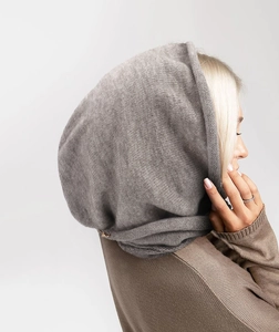Close-up of gray knitted hood scarf showing soft faux cashmere texture and weaving detail