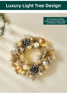Detail of silver Christmas wreath with golden pinecones, ornaments and warm LED lights