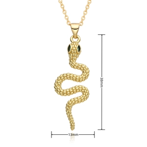 Detailed view of snake pendant with micro-set green eyes and gold-plated scale textures