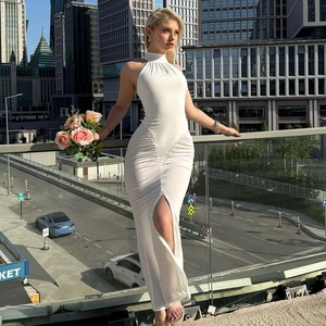 White sleeveless halter neck maxi dress with side ruched details and high slit