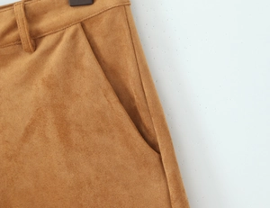 Detail of camel suede jacket waist tailoring and side pocket craftmanship