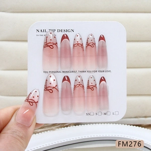 Pink gradient cat-eye press-on nails with red French tips and bow accents, size FM276