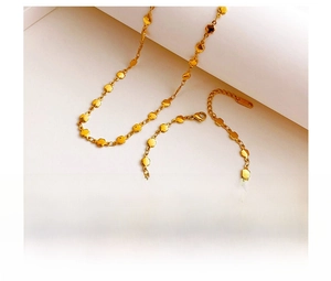 Detailed macro view of vacuum plated titanium steel gold necklace with round metal links