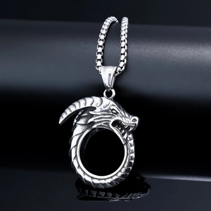 Close-up of dragon head hoop pendant with scales on a black box chain necklace