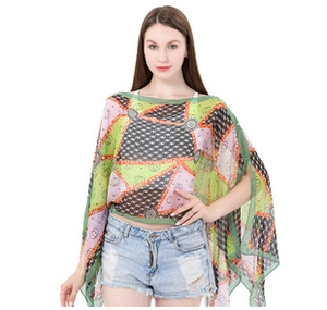 Close-up of lightweight chiffon silk scarf with geometric abstract patterns in green and pink