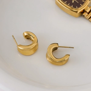 Minimalist thick gold C-shaped hoop earrings in polished stainless steel for women