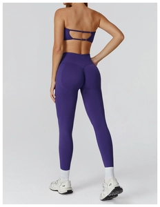 Deep purple seamless yoga set featuring high-waisted leggings and strappy sports bra back view