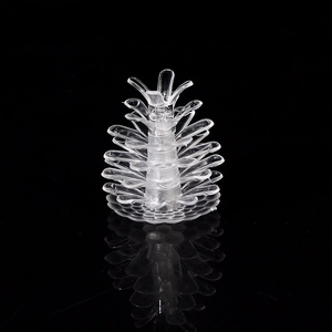 Transparent pine cone LED light accessory for Christmas tree decor on black background