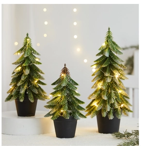 Set of 3 mini artificial Christmas trees with warm LED lights and glitter details