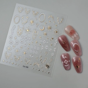 Gold and white star moon totem embossed nail stickers Co-105 with application on mauve nails