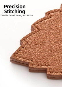 Detailed macro view of precision stitching on brown lychee-patterned leather hat clip