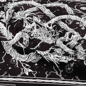 Bohemian black and white tapestry featuring gothic skeleton roots and celestial patterns