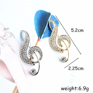 Sparkling crystal music note brooch in gold and silver finish with rhinestone inlay