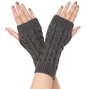 Close-up of dark grey cable knit fingerless gloves with a thick warm acrylic texture
