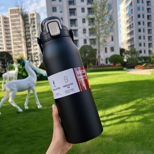 Detail of matte black stainless steel vacuum flask with straw and outdoor bounce lid