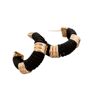 Gold-tone C-shape hoop earrings wrapped with black faux leather and textured metal