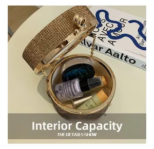 Detail showing the internal storage capacity of the round gold rhinestone evening clutch bag