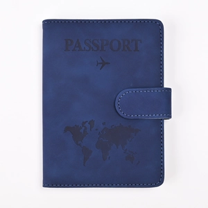 Close-up of deep blue RFID PU leather passport holder with embossed map and buckle strap