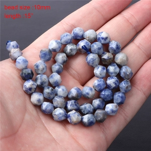 Macro detail of 10mm faceted blue dot stone beads for DIY jewelry making 15 inch strand