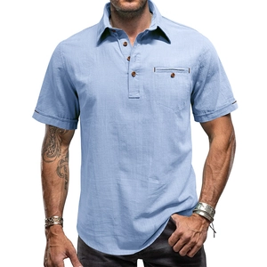 Detail of light blue linen shirt featuring a three-button neckline and functional chest pocket