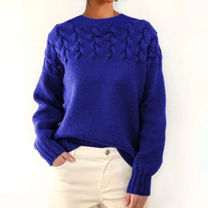 Detailed cable knit texture on a royal blue long-sleeve crewneck sweater for women