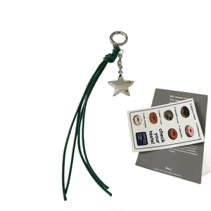 Y2K style star pendant with dark green tassels and silver metal spring clasp