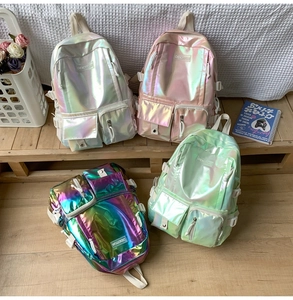 Detailed view of the iridescent laser PU texture and reinforced stitching on this backpack