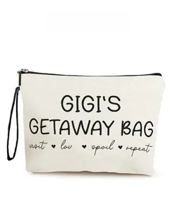 Close-up of canvas makeup bag featuring GIGI'S GETAWAY BAG text and black top zipper