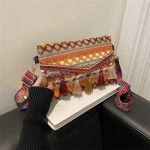 Close-up of bohemian crossbody bag with geometric patterns and colorful long tassels