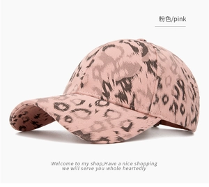 Detail of pink leopard print baseball cap with classic curved brim and cotton texture
