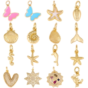 Gold ocean charms set with enamel starfish sea shells and dolphins for DIY jewelry