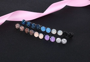 Macro shot of circular S925 silver cluster earrings in multiple sparkling colors