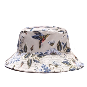 Satin floral bucket hat with hummingbird print and wide brim for sun protection