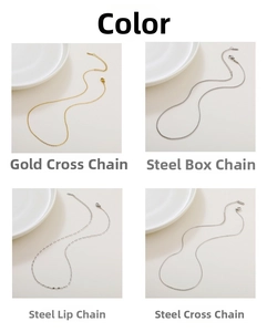 Detail of minimalist gold and steel rolo, box, and lip chains with lobster clasps